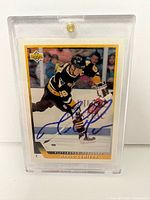 Front of Upper Deck Mario Lemieux card showing autograph and protective case