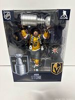Front view of sealed Mark Stone action figure holding Stanley Cup in retail packaging