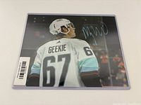 Front of 8x10 photo showing Geekie jersey and signature