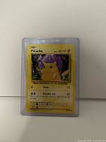 Front of Pikachu card in sleeve showing 60 HP and attack details