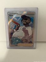 Front of Rose Trainer Supporter holofoil card inside plastic toploader