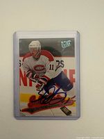 Front view of autographed Saku Koivu Fleer Ultra card in sleeve