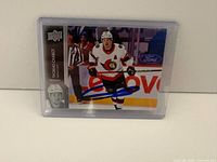 Front view of signed Thomas Chabot card in sleeve