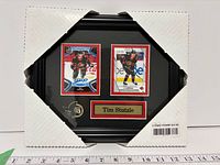 Framed Tim Stutzle two-card display with protective corners, ruler for scale