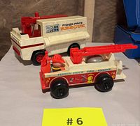 Front three-quarter view showing both Rescue Truck and Fire Engine with decals visible