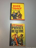 Front covers of both miniature books