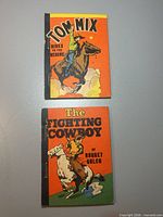 Front covers of both miniature books