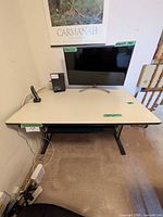 Front view of laminate desk showing top surface, keyboard tray and legs