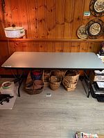 Full view of grey folding banquet table with metal legs