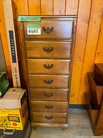 Full view of tall seven-drawer wood highboy dresser