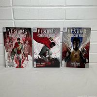 Front covers of the three Shades of Magic volumes