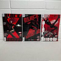 Front covers of all three Black Widow volumes