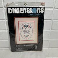 Front of sealed Dimensions Love Endures kit showing design and branding