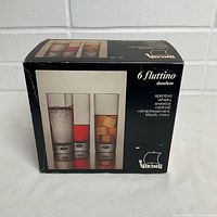 Closed box front showing branding and product image