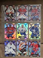 Front view of nine hockey cards in binder sleeve