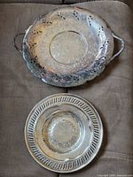 Front view of both trays showing designs, handles and rims