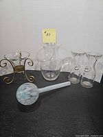 overall view of five glass items