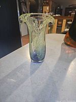 Full view of mottled glass vase showing flared rim and color gradient