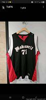 Full front view of Makaveli 71 black and red jersey on hanger