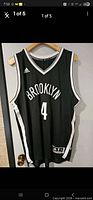 Front view of Adidas Brooklyn Nets jersey showing Brooklyn text and number 4
