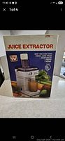 Front of boxed W.W.I juice extractor showing packaging graphics
