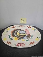 Front view of oval hand-painted turkey platter