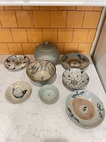 Group shot of all eight ceramic pieces