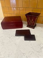 Closed humidor, planter and two wallets