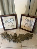 Overall lot showing two framed prints and wood applique