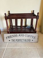 Magazine rack front view with sign leaning