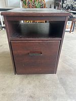 front view showing open shelf, drawer, handle, overall finish