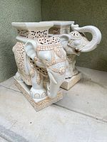 Both ceramic elephant garden stools side by side