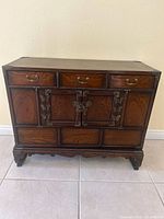 Front view of Asian style cabinet closed