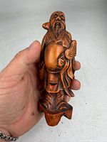 Front view of carved boxwood elderly man figure