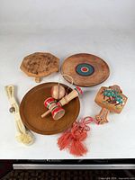 All items overview: stand, trays, kendama toys, hagoita paddle, braided cord