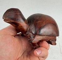 angled view of the hand carved rosewood turtle