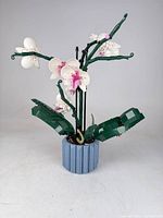 Full view of assembled LEGO orchid in pot