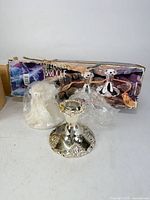 Pair of silver-plated candleholders with box