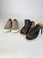 Both pairs of shoes side by side