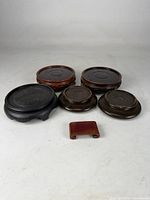 Group shot of all six wooden stands