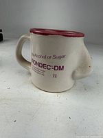 Full view of mug showing nose shape and printed branding