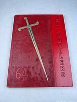 Front cover with embossed sword, title, numeral 64