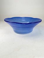 Full view of blue glass bowl showing overall shape and color