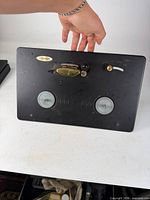 Full view of Heathkit black panel with two reel hubs and controls