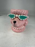 Front view showing poodle face with sunglasses and texture