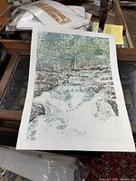 Full view of unframed woodblock print on table