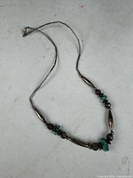 Full view of necklace showing bead arrangement and clasp