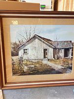 Full view of framed barn landscape print inside wood frame