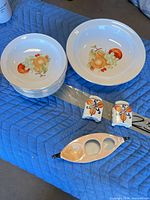 Group view: stack of bowls, serving bowl, relish dish, salt & pepper shakers