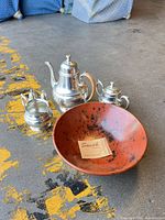 Group shot of terracotta bowl, pewter teapot, creamer, sugar bowl, salt & pepper shakers